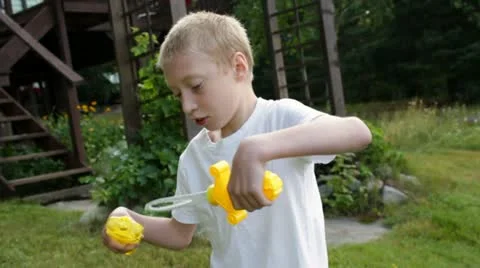 Boy Blowing Bubbles Video stock 11632922