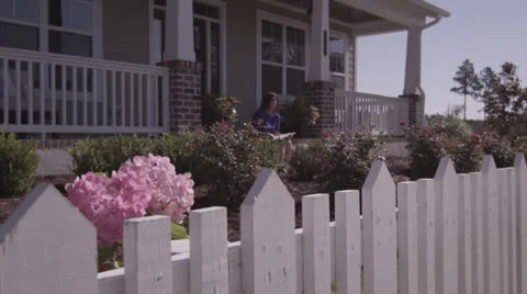 Boy Blowing Bubbles As One Passes In Front of Lense Video stock 25996240