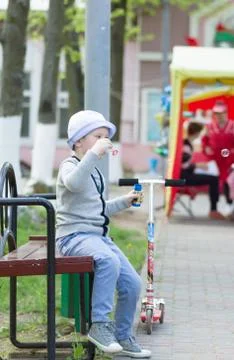 Boy blowing bubbles Stock Photos