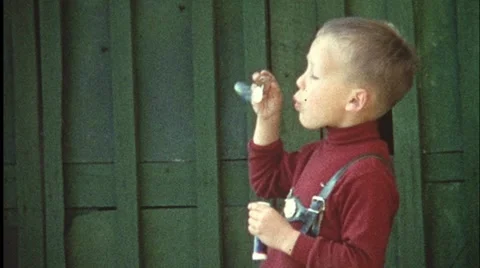 Boy blowing bubbles (vintage 8 mm amateur film) Stock Footage 1009744
