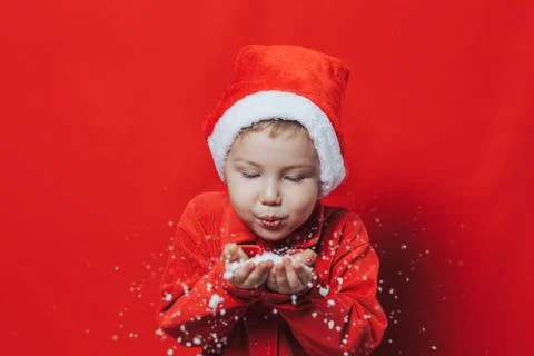 Boy blowing snow Stock Photos