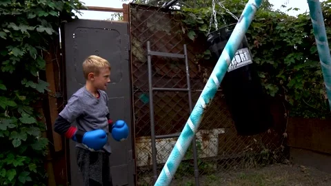 Boy in blue boxing gloves Видео 207769675