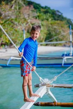 Boy on the boat Illustrazione stock