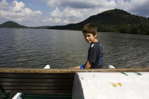 Boy on boat Stock Photos