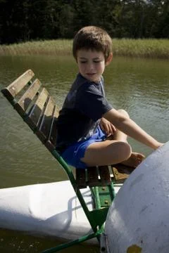 Boy on boat Stock Photos