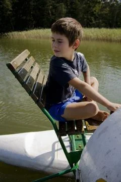 Boy on boat Stock Photos
