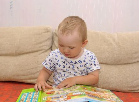 Boy with a book Stock Photos
