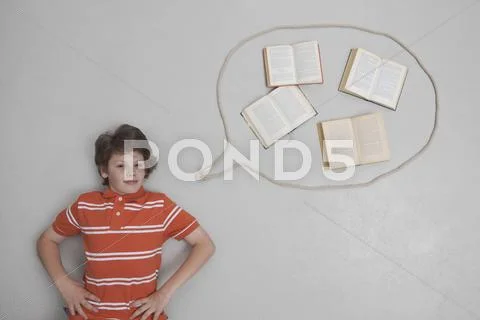 Boy with books in speech bubble, portrait Stock Photos
