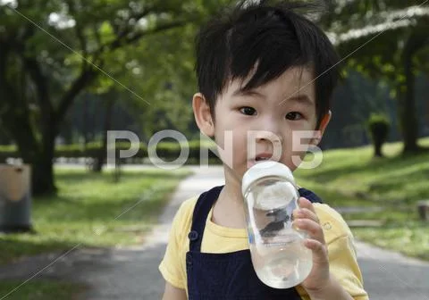 Boy with bottle Stock Photos