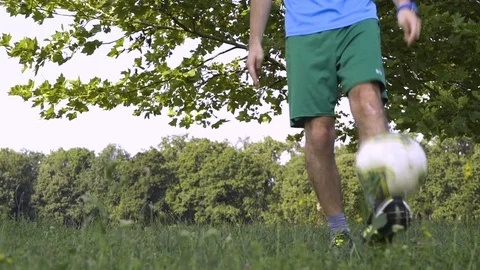 Boy Bouncing a Ball in the Park Video stock 83159983
