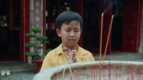 Boy Bowing Down when Praying by Ancient Burner Stock Footage 285401955