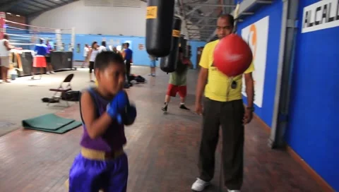 Boy Boxes at Training Center (HD) co Stock Footage 1217579