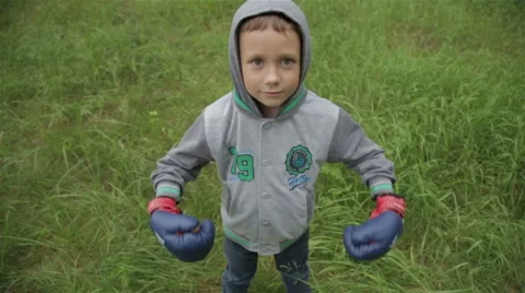 Boy in boxing gloves Stock Footage 64384928