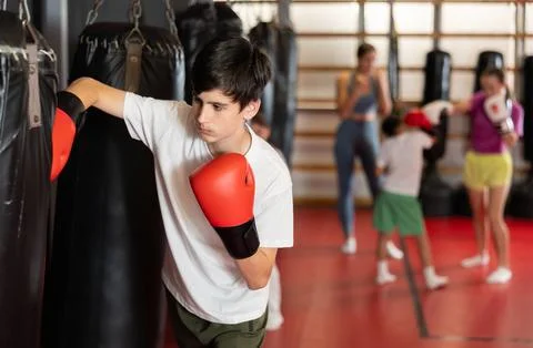 Boy in boxing gloves in training Stock Photos