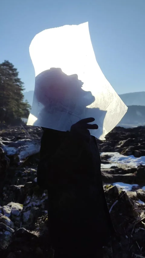 Boy breaks ice on a sunny winter day. Stock Footage 304979693