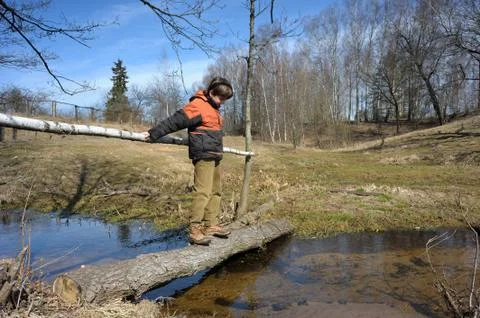 Boy on the bridge Stock Photos