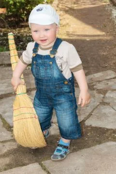 The boy with a broom Stock Photos