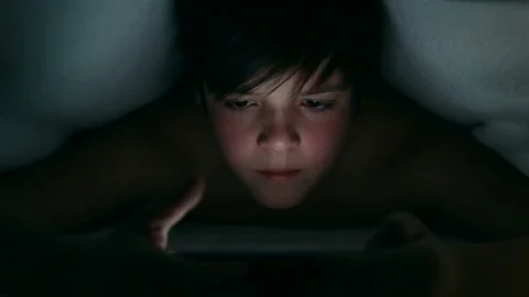 Boy browsing digital content using his smartphone Stock Footage 80006428