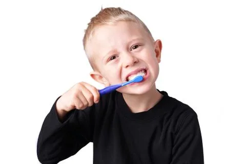 Boy brushes his teeth Stock Photos