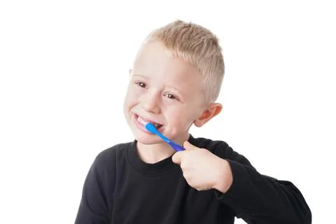Boy brushes his teeth Stock Photos