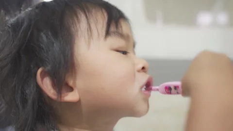 Boy brushing and cleaning teeth Stock Footage 193782661