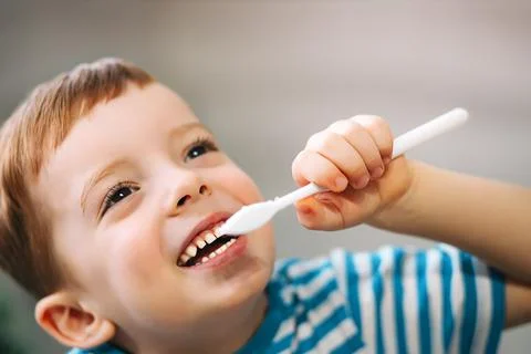 Boy brushing his teeth, close-up Stock Photos