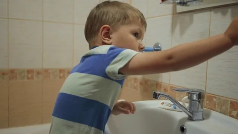 Boy brushing his teeth Stock Footage 76606303