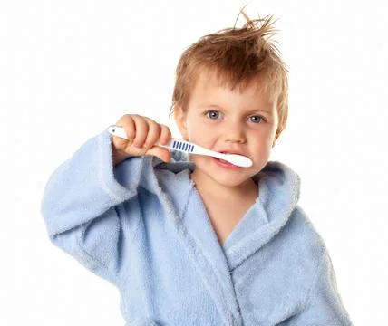 Boy brushing his teeth Stock Photos