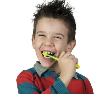 Boy brushing his teeth Stock Photos
