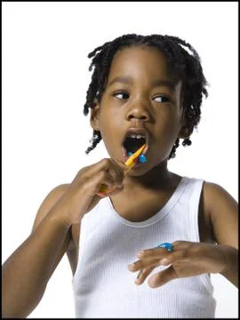 Boy brushing his teeth Stock Photos