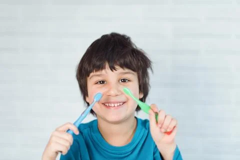 Boy brushing his teeth Stock Photos