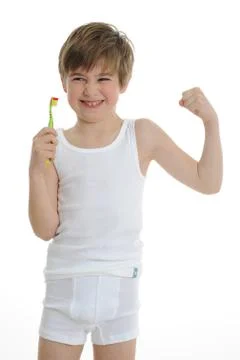 Boy is brushing teeth Stock Photos