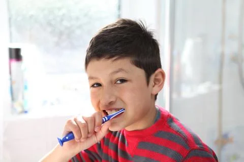 Boy brushing teeth  Stock Photos