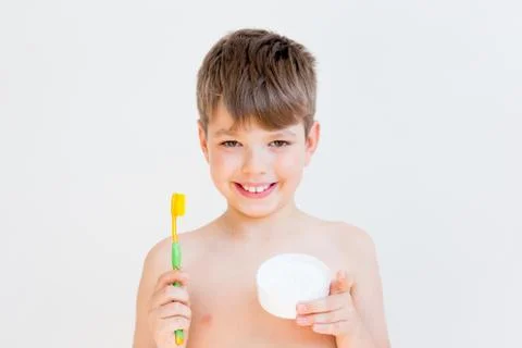 Boy is brushing teeth Stock Photos