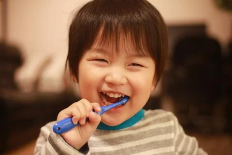 Boy brushing teeth Stock Photos