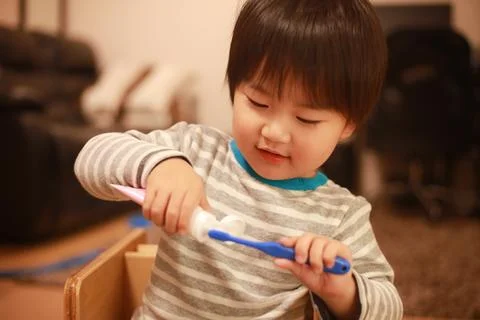 Boy brushing teeth Stock Photos