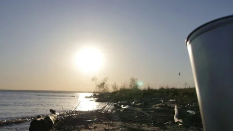 The boy with the Bucket runs parallel to the Shore Stock Footage 105264230