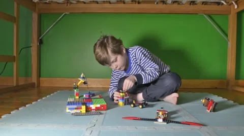 Boy building with Lego Stock Footage 46969851