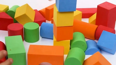 The boy builds plays on a white background Video stock 127754192