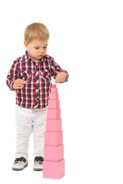 Boy builds a pyramid Stock Photos