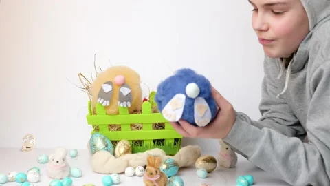 Boy with bunny ears playing with a soft toy rabbit in basket Stock-Footage 147718581