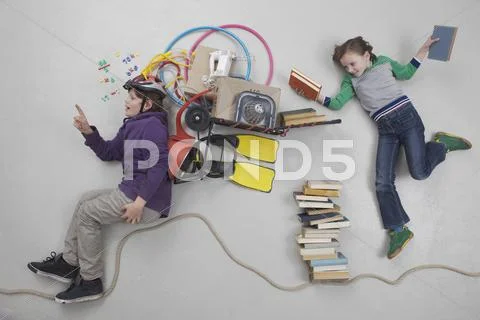 Boy calculating while girl holding books Stock Photos