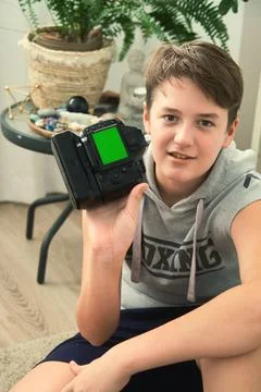 A boy with camera in his hands Foto stock