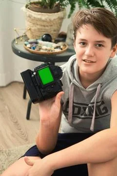 A boy with camera in his hands 스톡 사진