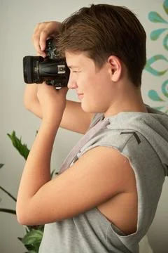 A boy with camera in his hands Foto stock