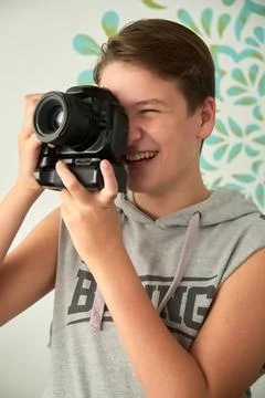 A boy with camera in his hands Foto stock