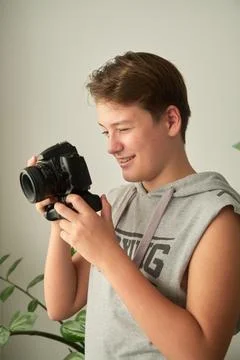 A boy with camera in his hands Stock-Fotos