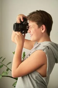 A boy with camera in his hands 스톡 사진