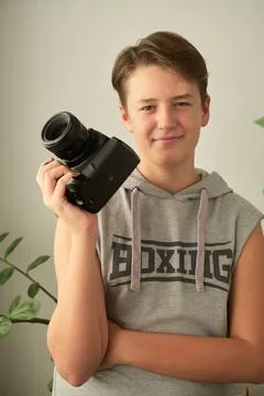 A boy with camera in his hands Foto stock