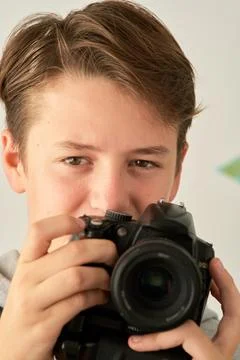 A boy with camera in his hands Stock-Fotos